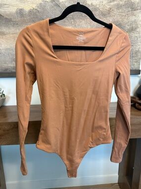 nuuds Scoop Neck Long-Sleeve Bodysuit in Tan